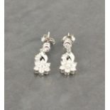 18ct white gold daisy style drop diamond earrings, diamonds 1.30ct (stamped 0.66 / 0.64)