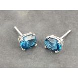 A pair of London Blue topaz ear studs, with claw settings in silver, 2gms, boxed