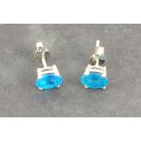 A pair of apatite ear studs, the oval stones claw set in silver,