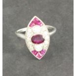 A ruby and diamond set dress ring, marquise shaped, in a platinum setting and band, 4.5gms