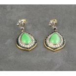 A pair of jade and diamond set pear shaped ear pendants, cobochon central stones within onyx and