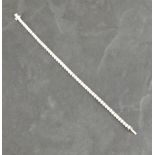 A diamond line bracelet, the brilliant cut stones (approx.  5..04 total weight) claw 18ct white