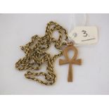 A 9ct. rope twist neck chain and a unmarked gold cross 5.7