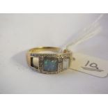 An unusual opal and diamond ring set in 9ct.(stone missing) 3.2g.