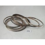 Eight silver bangles 93g