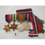 A bar of four WWII medals