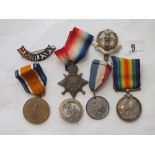 A WWI trio of medals to PTE. G. F. Dellar Middx Regiment (S 6843) & badges etc plus a framed