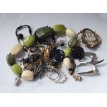 A bag of mixed costume jewellery with cameo, rings, chains Brooches etc.