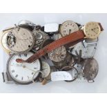 Box containing various vintage watch movements