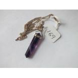 Silver mounted amethyst crystal pendant on silver chain