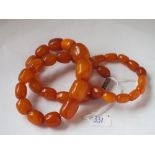 An amber bead necklace and matching bracelet