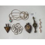 Six silver pendants and a chain