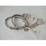 Two silver bangles and a silver gate bracelet