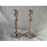 PAIR OF TALL CANDLESTICKS of oval moulded section, 12” high Lon mod by DJ & S