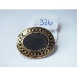 Gold and enamel mourning brooch