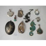 Ten silver pendants