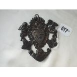 Antique mount embossed with winged infants, 4.5” high