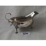 Small Georgian sauce boat, gadrooned rim, 5” over flying scroll handle Lon 1770 96g.