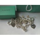 Silver Tiffany suite of necklace, bracelet and earrings with associated box and pouch