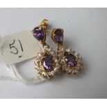 Pair of attractive gold mounted purple & white stone drop earrings 6.9g inc