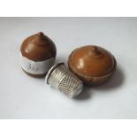 Silver thimble in a carved acorn shaped case