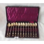 Boxed set of twelve silver gilt, tea spoons with Gothic terminals, 5.5” long 170g.