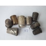 Eight silver and other thimbles etc