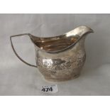 Georgian boat shaped cream jug engraved with vine leaves, 5”over handle Lon 1809 96g.