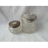 Two mounted and cut glass jars