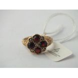 A garnet ring with pearls set in 9ct – size O – 3.7gms