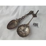 Indian silver caddy spoon with deity and a Dutch caddy spoon with embossed bowl