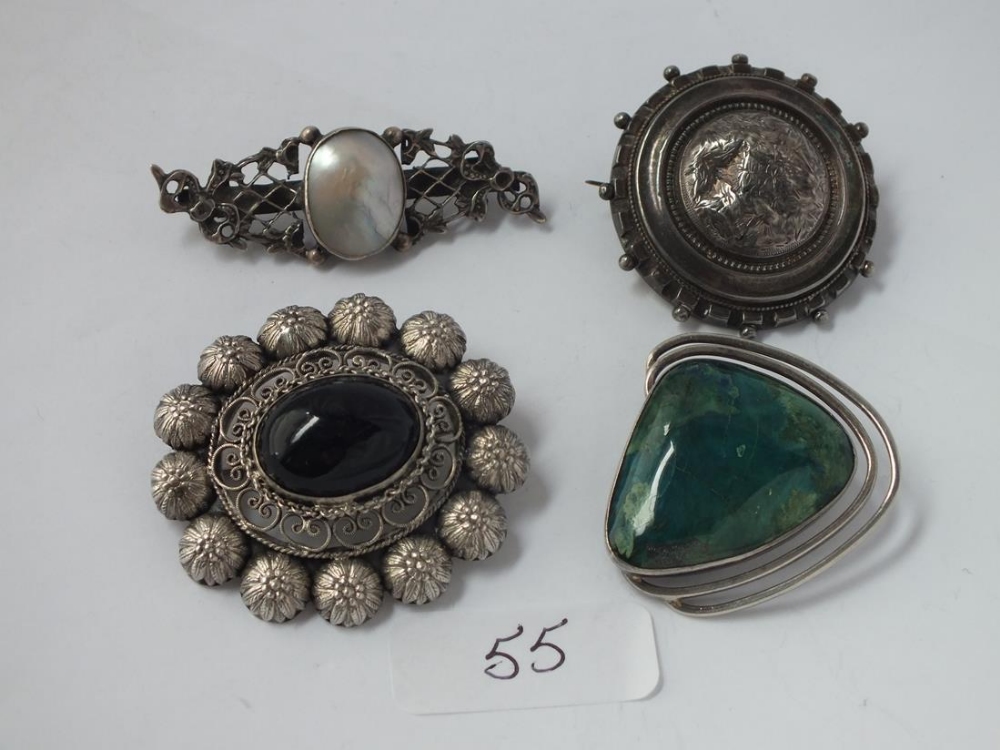 Four silver brooches