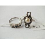 Two silver stone set rings