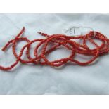 Three strings of coral bead