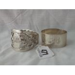 Napkin ring pierced and embossed with thistle motives – Sheff 1913 and another – 1943 - 58gms