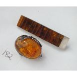 Two nice silver and amber brooches