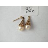 Pair of 9ct and pearl earrings (one hook missing)