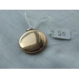 Circular gold Victorian locket marked 15ct – 8.3gms