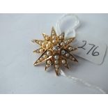Good 18ct gold pearl star brooch with central diamond