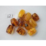 Ten oval amber drilled beads the largest 2cm long - 24.2g