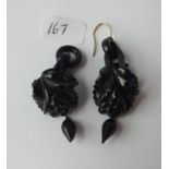 Pair of carved jet dropped earrings (one gold hook missing)