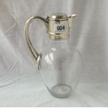 Good late Victorian claret jug with flask shaped glass body, hinged silver cover – 9” high – 1884 by