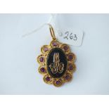 18ct oval eastern pendant surmounted with gem stones