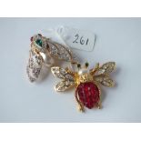 Two costume jewellery bug brooches