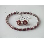 18ct white gold ruby and diamond line bracelet and matching earrings