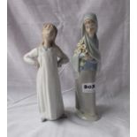 Two figures – one holding flowers – 8” & 9” high