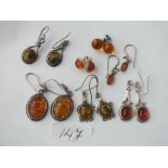 Six pairs silver & amber earrings 28g inc
