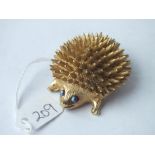 Large 2" long gilt metal hedgehog brooch with stone set eyes