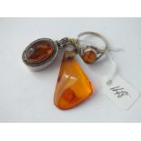 Two silver & amber pendants and a silver & amber ring 14.5g inc
