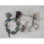 Bag with silver brooch pendants etc.,